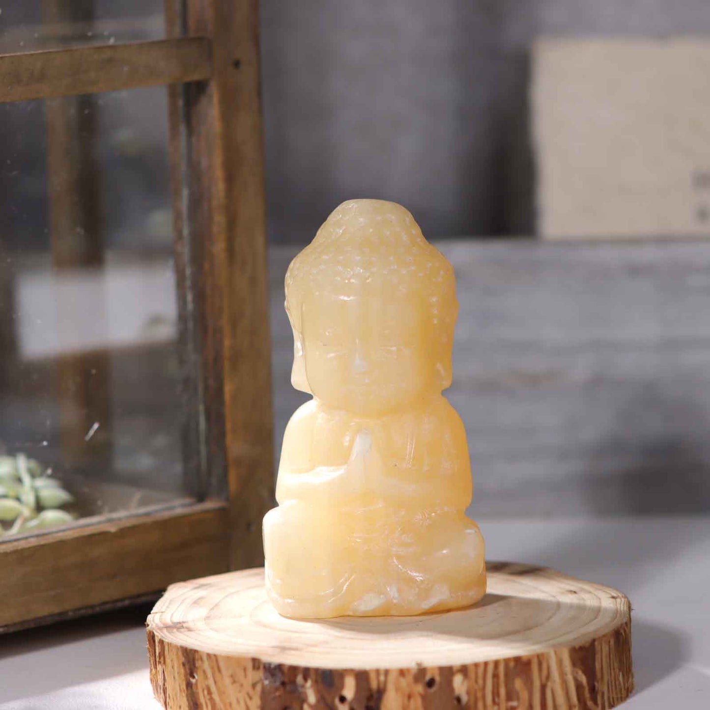 Yellow Calcite Buddha Statues